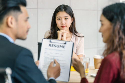 young person at interview with two managers