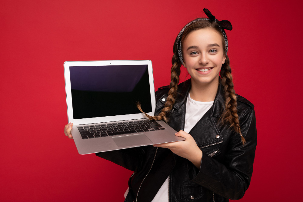 young adult with laptop