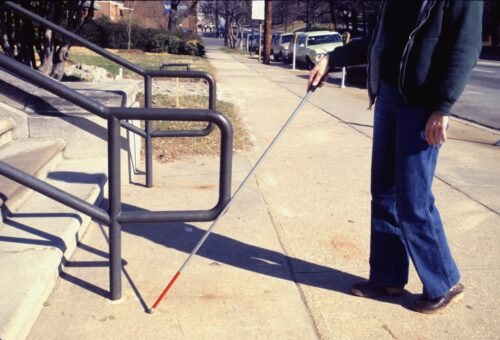 blind person with guide stick
